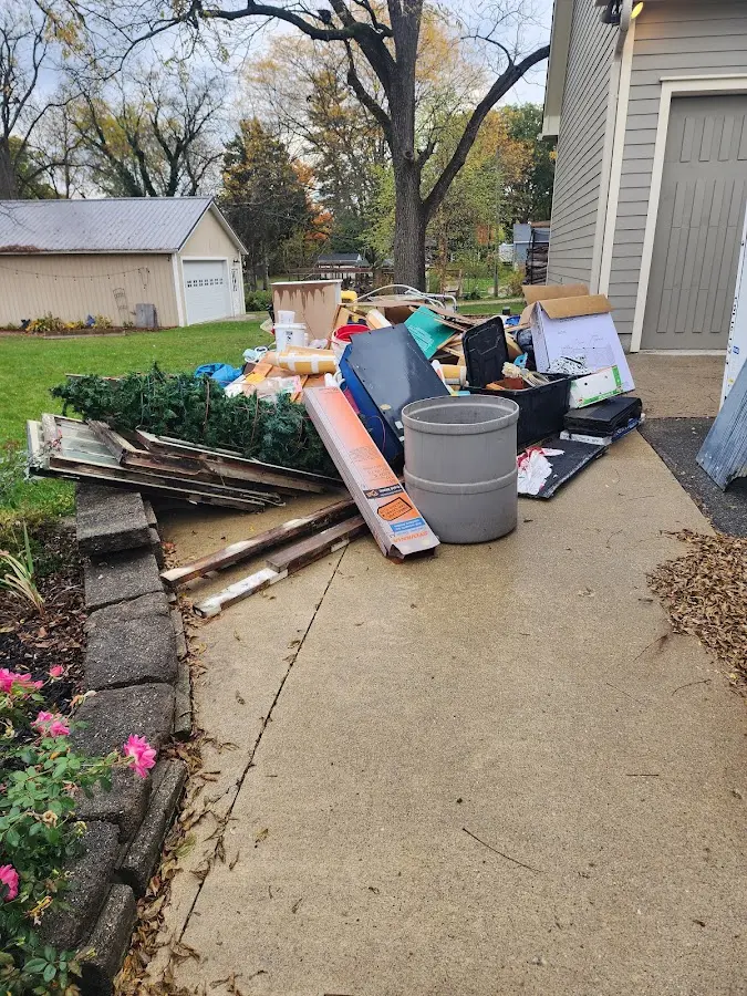 Dumpster being loaded with debris for 30 Yard Dumpster Rental in Indianapolis